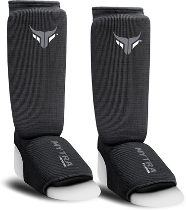 Захисники ніг для кікбоксингу Junior - легкі, дихаючі, з підкладкою, чорні. Підходять для кікбоксингу, муай-тай, MMA. Розмір XXS.