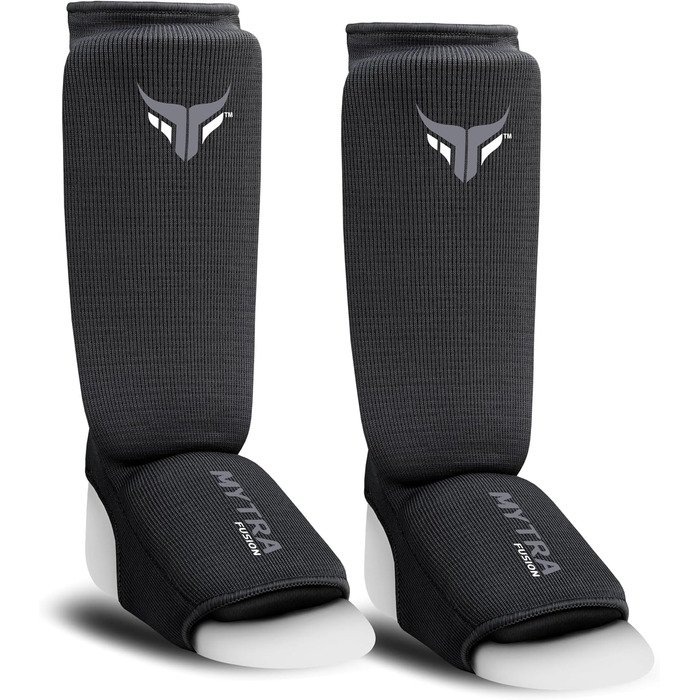 Захисники ніг для кікбоксингу Junior - легкі, дихаючі, з підкладкою, чорні. Підходять для кікбоксингу, муай-тай, MMA. Розмір XXS.
